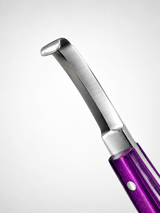Angled full view of professional double-edge hoof knife with
purple handle and J2 420 stainless steel blade