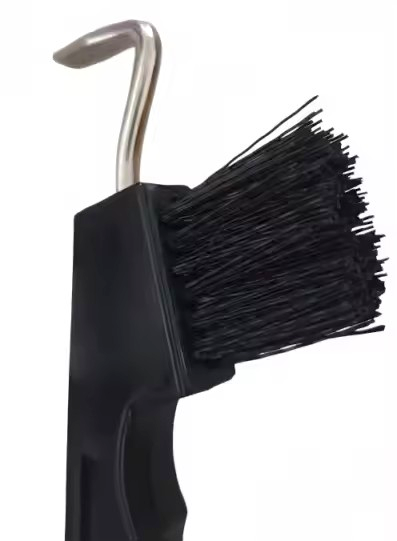 Close-up of metal hook tip and stiff black bristle brush on Equine Tools Direct horse hoof pick